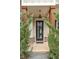 Inviting front porch with wooden beams and trimmed landscaping at 1993 Haley Walk, Atlanta, GA 30318