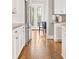 Modern kitchen featuring hardwood floors, white cabinets, and stainless-steel refrigerator at 1993 Haley Walk, Atlanta, GA 30318