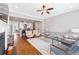 Open concept living room with fireplace, hardwood floors, and neutral decor at 1993 Haley Walk, Atlanta, GA 30318