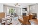 Bright living room with hardwood floors, fireplace, and large windows offering natural light and neighborhood views at 1993 Haley Walk, Atlanta, GA 30318