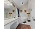 Spacious bathroom with a large vanity, garden tub, and dark wood flooring at 76 Barrington Farms Pkwy, Sharpsburg, GA 30277
