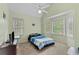 Cozy bedroom with high ceilings, large windows, and a comfortable bed at 76 Barrington Farms Pkwy, Sharpsburg, GA 30277