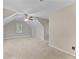Spacious carpeted bedroom with neutral walls, ceiling fan, and natural light from a window at 76 Barrington Farms Pkwy, Sharpsburg, GA 30277