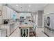 Open kitchen design with stainless steel appliances, granite countertops, and a center island at 76 Barrington Farms Pkwy, Sharpsburg, GA 30277