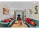 Bright living room with comfortable seating, hardwood floors, and large windows with natural light at 76 Barrington Farms Pkwy, Sharpsburg, GA 30277