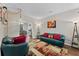 Comfortable living room with stylish decor, hardwood floors, and easy access to the dining area at 76 Barrington Farms Pkwy, Sharpsburg, GA 30277