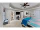 Spacious main bedroom with tray ceilings, a fan, and plenty of room at 76 Barrington Farms Pkwy, Sharpsburg, GA 30277
