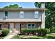 Charming two-story townhouse featuring brick and siding exterior with well-maintained landscaping at 1215 Willow Creek Nw Ct, Conyers, GA 30012