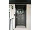 Front door entrance featuring a decorative wreath, black painted door, and brick facade at 351 Cherokee Ave, Atlanta, GA 30312