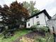 Two story brick home with lovely yard and landscaping featuring a beautiful tree at 351 Cherokee Ave, Atlanta, GA 30312