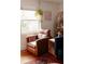 Living room featuring reading chair, hanging plants, and hardwood floors at 351 Cherokee Ave, Atlanta, GA 30312