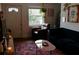 Charming living room featuring a plush blue couch, area rug, and stylish decor at 351 Cherokee Ave, Atlanta, GA 30312