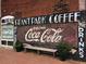 Exterior brick wall with a Grant Park Coffee and Coca-Cola mural, adding charm and character to the building's facade at 351 Cherokee Ave, Atlanta, GA 30312