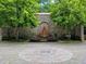 Landscaped park entrance with stone fountain and manicured greenery at 351 Cherokee Ave, Atlanta, GA 30312