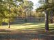 Picturesque park scene with trees and grassy landscape, lit by sunlight at 351 Cherokee Ave, Atlanta, GA 30312