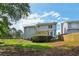 Backyard with the house siding, a small wooden deck, and a small fenced area at 3970 Genoa Ct, Duluth, GA 30096