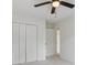 Bedroom featuring a large closet, neutral carpet, ceiling fan, and natural light from a window at 3970 Genoa Ct, Duluth, GA 30096