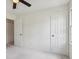Bedroom featuring a ceiling fan, neutral carpet, and a window providing natural light at 3970 Genoa Ct, Duluth, GA 30096