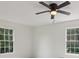 This bedroom has large windows and a ceiling fan at 3970 Genoa Ct, Duluth, GA 30096