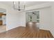 Open dining area with hardwood floors and seamless connection to the kitchen and living room at 3970 Genoa Ct, Duluth, GA 30096