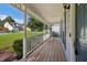Long front porch with railings and wood floor at 3970 Genoa Ct, Duluth, GA 30096