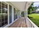 Spacious front porch with wood floors and white railings, perfect for relaxing at 3970 Genoa Ct, Duluth, GA 30096