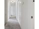 Bright hallway featuring neutral walls and plush carpet at 3970 Genoa Ct, Duluth, GA 30096