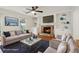 Cozy living room with fireplace, built-in shelves, and ample seating at 3970 Genoa Ct, Duluth, GA 30096
