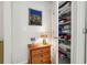 Hallway with drawers, closet with shelves, and a framed picture at 5105 Kings Common Way, Cumming, GA 30040