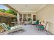 Inviting covered porch with comfortable seating for relaxation and outdoor enjoyment at 5105 Kings Common Way, Cumming, GA 30040