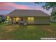 Backyard with screened porch, grill, and green space - perfect for outdoor enjoyment at 11581 Kades Trl, Hampton, GA 30228