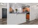An open kitchen features wood cabinets, stainless appliances, and a breakfast bar at 11581 Kades Trl, Hampton, GA 30228