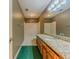 Bathroom featuring a tub with a shower, vanity with granite, and hardwood cabinets at 3290 Spain Rd, Snellville, GA 30039