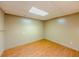 Cozy bedroom with wood flooring, blank canvas walls, and natural light from above at 3290 Spain Rd, Snellville, GA 30039