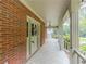 Charming front porch with brick siding, white columns, and decorative details at 3290 Spain Rd, Snellville, GA 30039