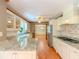 Updated kitchen with granite countertops, stainless steel appliances, and white cabinetry at 3290 Spain Rd, Snellville, GA 30039