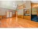 Open living room boasts soaring ceilings, fireplace, wet bar and hardwood floors at 3290 Spain Rd, Snellville, GA 30039