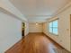 Bright living room with hardwood floors, ceiling fan and access to other areas at 3290 Spain Rd, Snellville, GA 30039
