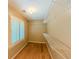 Walk-in closet with white wire shelving, a window, and hardwood floors at 3290 Spain Rd, Snellville, GA 30039