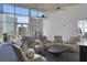 Common game room with billiard table, comfortable seating area, and large windows showing city views at 3325 Piedmont Ne Rd # 2104, Atlanta, GA 30305