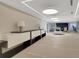 Bright condo lobby area with modern decor, ample seating, and a sleek reception desk at 3325 Piedmont Ne Rd # 2104, Atlanta, GA 30305