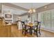 Inviting dining area features hardwood floors, natural light, and seamless flow to the living room, great for gatherings at 6302 Manassas Nw Pass, Acworth, GA 30101