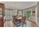 Elegant dining room with beautiful hardwood floors, large windows, and a stylish chandelier at 6302 Manassas Nw Pass, Acworth, GA 30101