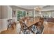 Cozy dining room featuring hardwood floors, natural light, and a classic chandelier at 6302 Manassas Nw Pass, Acworth, GA 30101