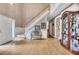Bright foyer features hardwood floors, a staircase with white trim, and a decorative bench at 6302 Manassas Nw Pass, Acworth, GA 30101
