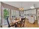 Charming eat-in kitchen with hardwood floors, white cabinetry, and access to a deck, perfect for outdoor dining at 6302 Manassas Nw Pass, Acworth, GA 30101
