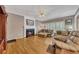 Comfortable living room with hardwood floors, a fireplace, and plenty of seating at 6302 Manassas Nw Pass, Acworth, GA 30101