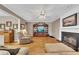 Inviting living room with hardwood floors, a cozy fireplace, and comfortable furnishings at 6302 Manassas Nw Pass, Acworth, GA 30101