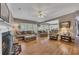 Open-concept living room featuring hardwood floors, a fireplace, and access to other rooms at 6302 Manassas Nw Pass, Acworth, GA 30101