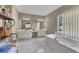 Spacious main bathroom featuring dual vanities, a soaking tub, and natural light at 6302 Manassas Nw Pass, Acworth, GA 30101